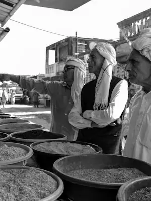 Customers browsing goods at a market